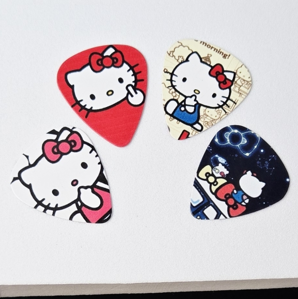 Hello Kitty Guitar Picks Set 4pcs .71mm Edgy Kawaii Plectrum Pack Cheeky Sassy - Picture 3 of 3